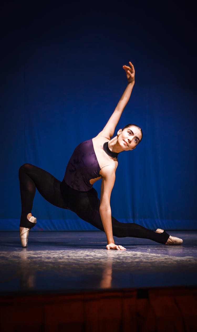 Ballerina Dancing On Stage