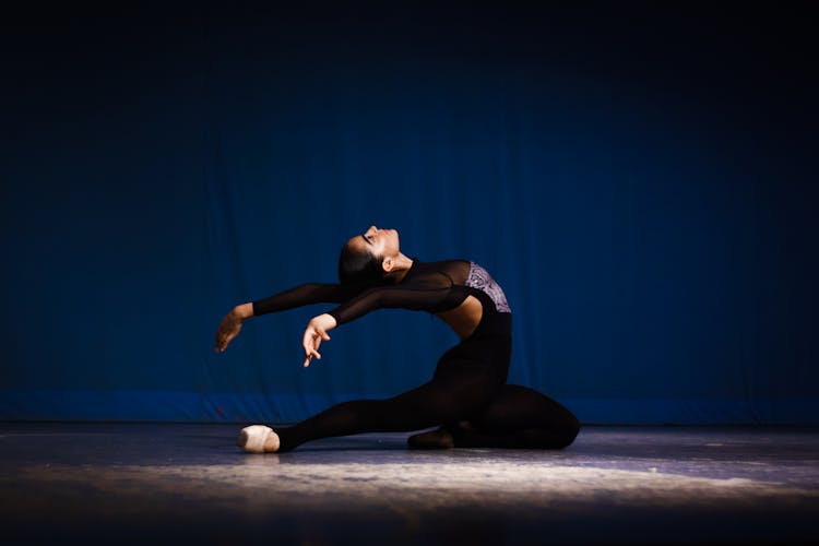 Ballerina Dancing On Stage