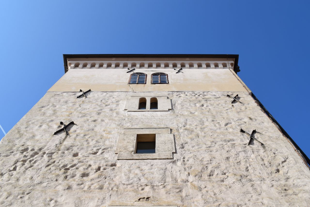low angle shot of a medieval tower facade in zagreb croatia under a cl