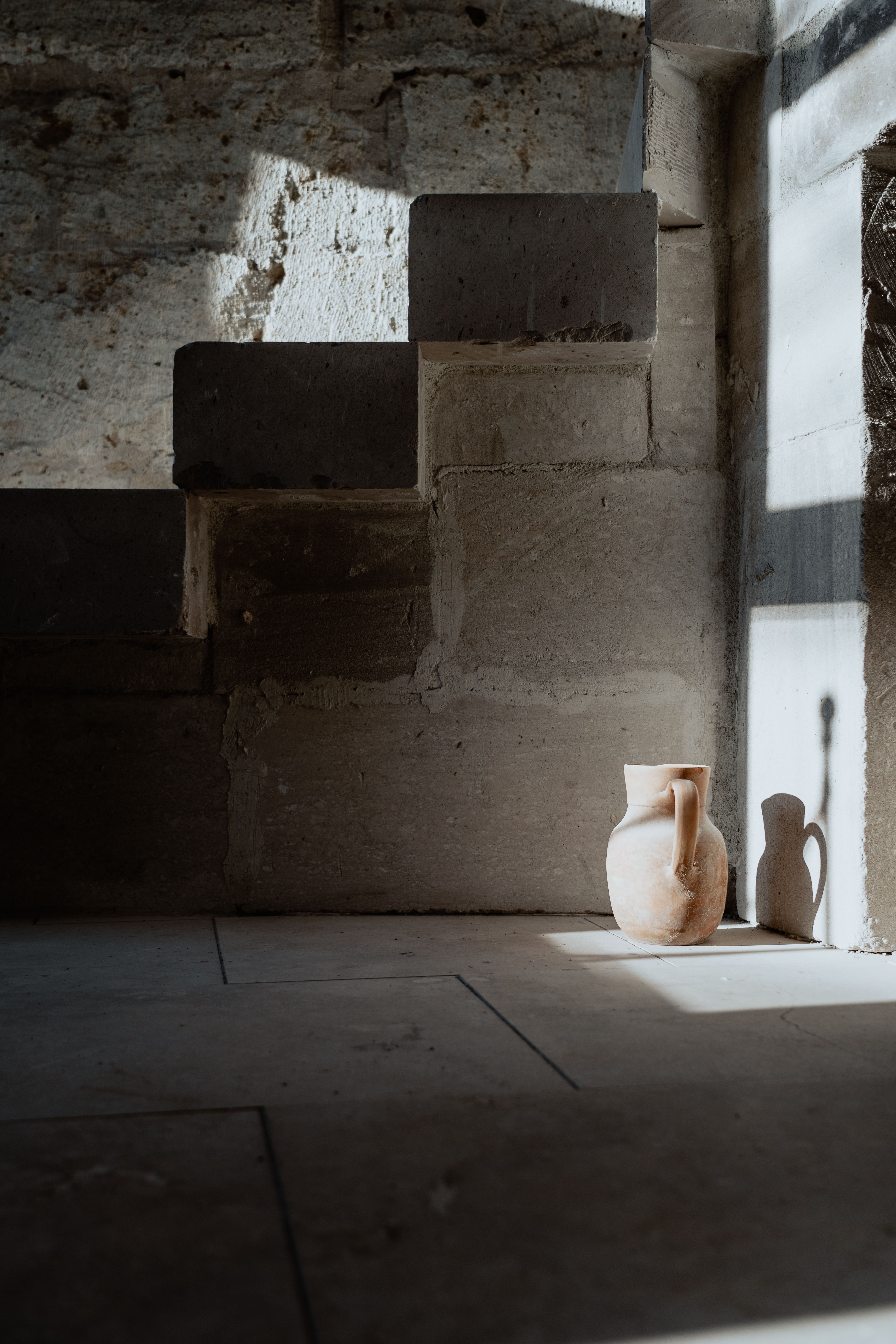 Vase Near Stone Walls · Free Stock Photo