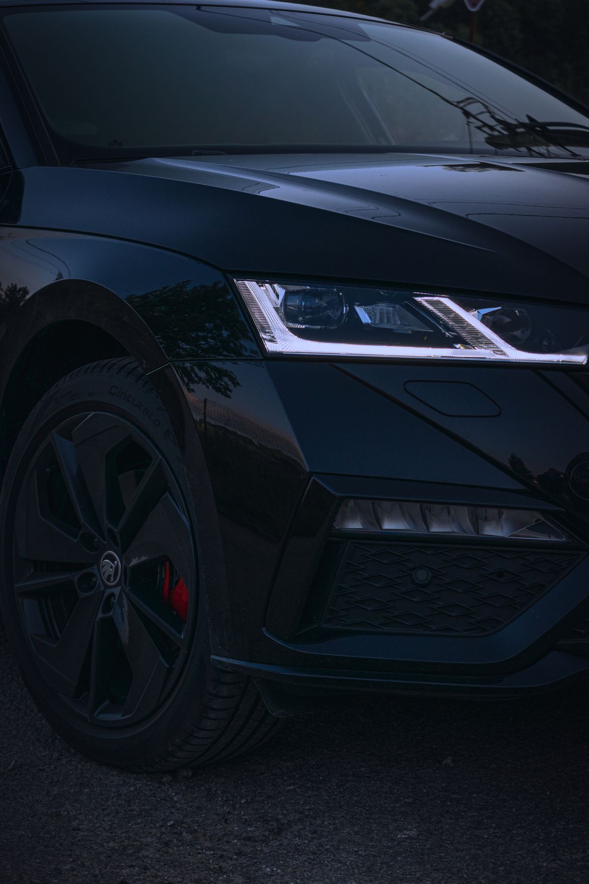 Crystal-clear restored sports car headlight at dusk