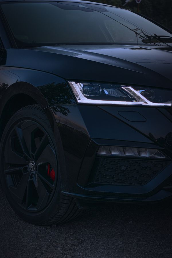 Crystal-clear restored sports car headlight at dusk