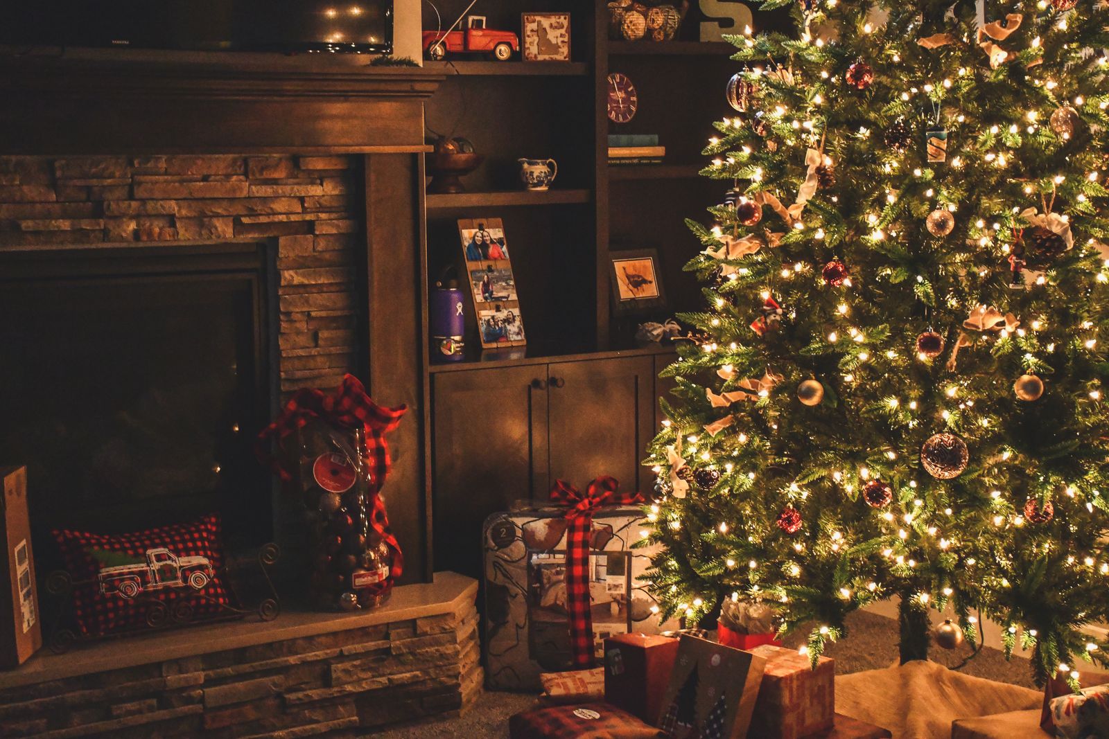 Lighted Christmas tree — evergreen conifer decorated with warm white lights, a central symbol of Christmas celebrations worldwide