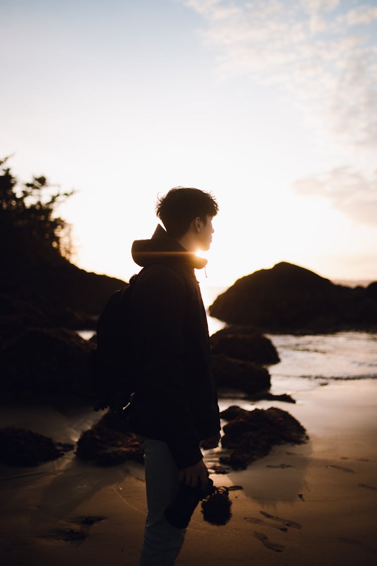 Photographer On Beach At Sunrise