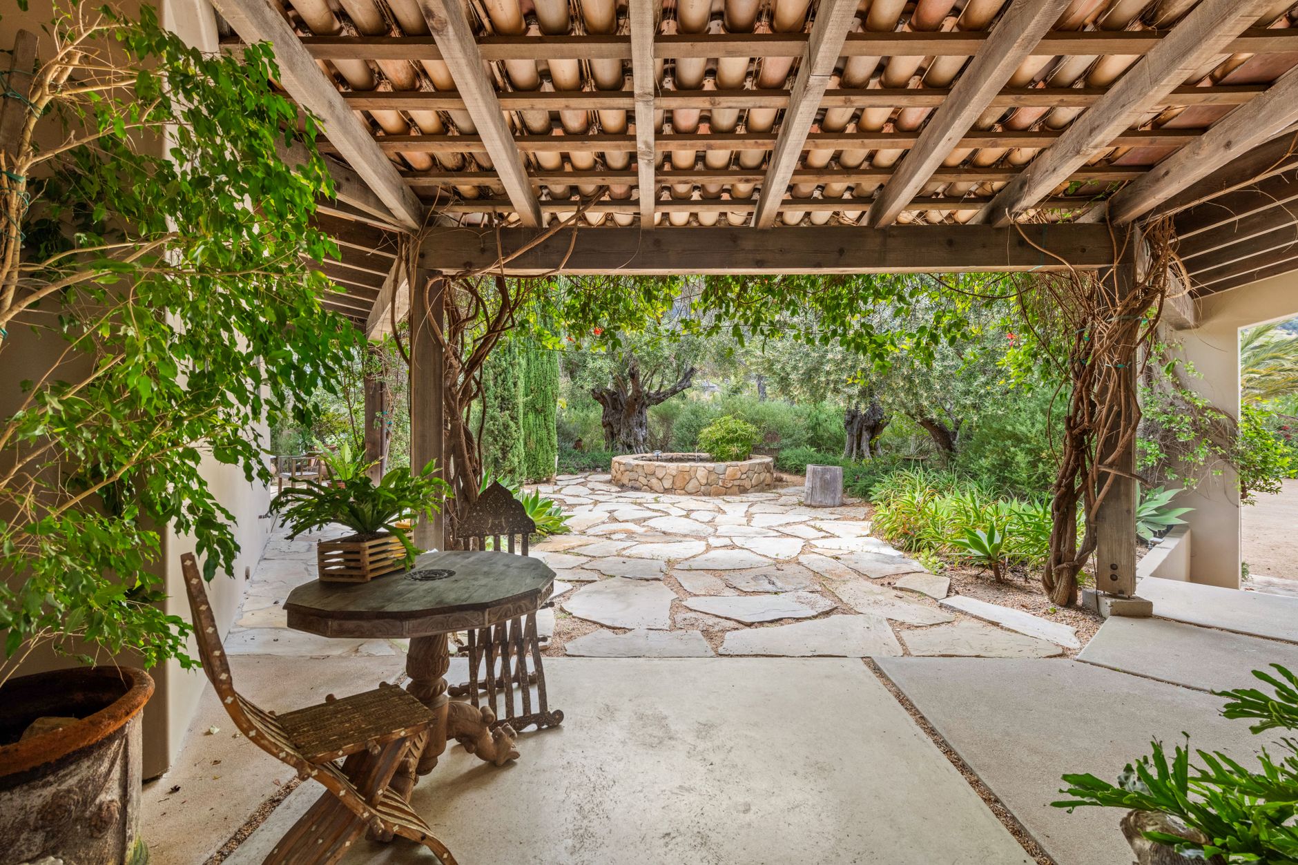Stone patio with a pergola