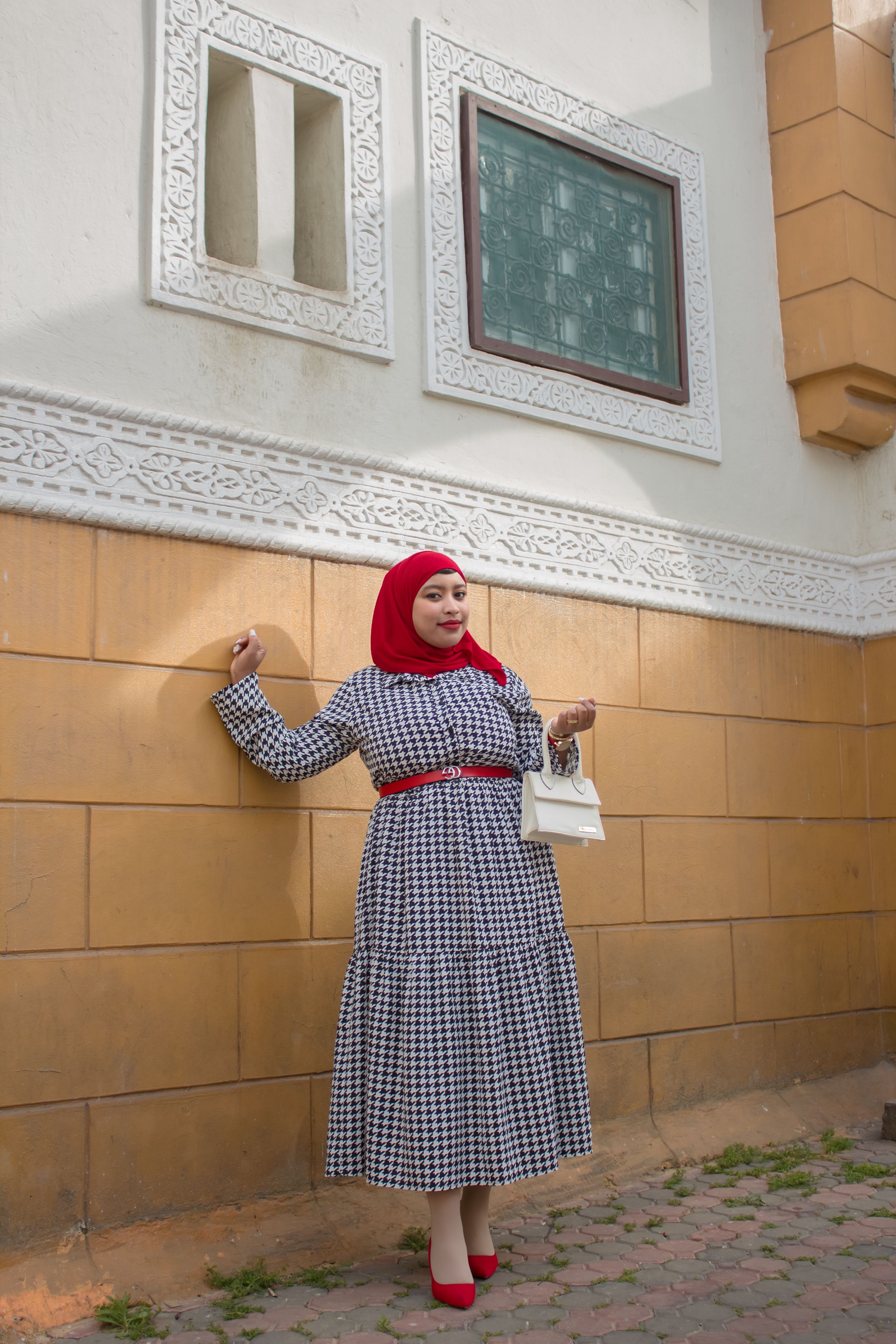 Woman Standing in the Red Hijab and Checkered Dress · Free Stock Photo