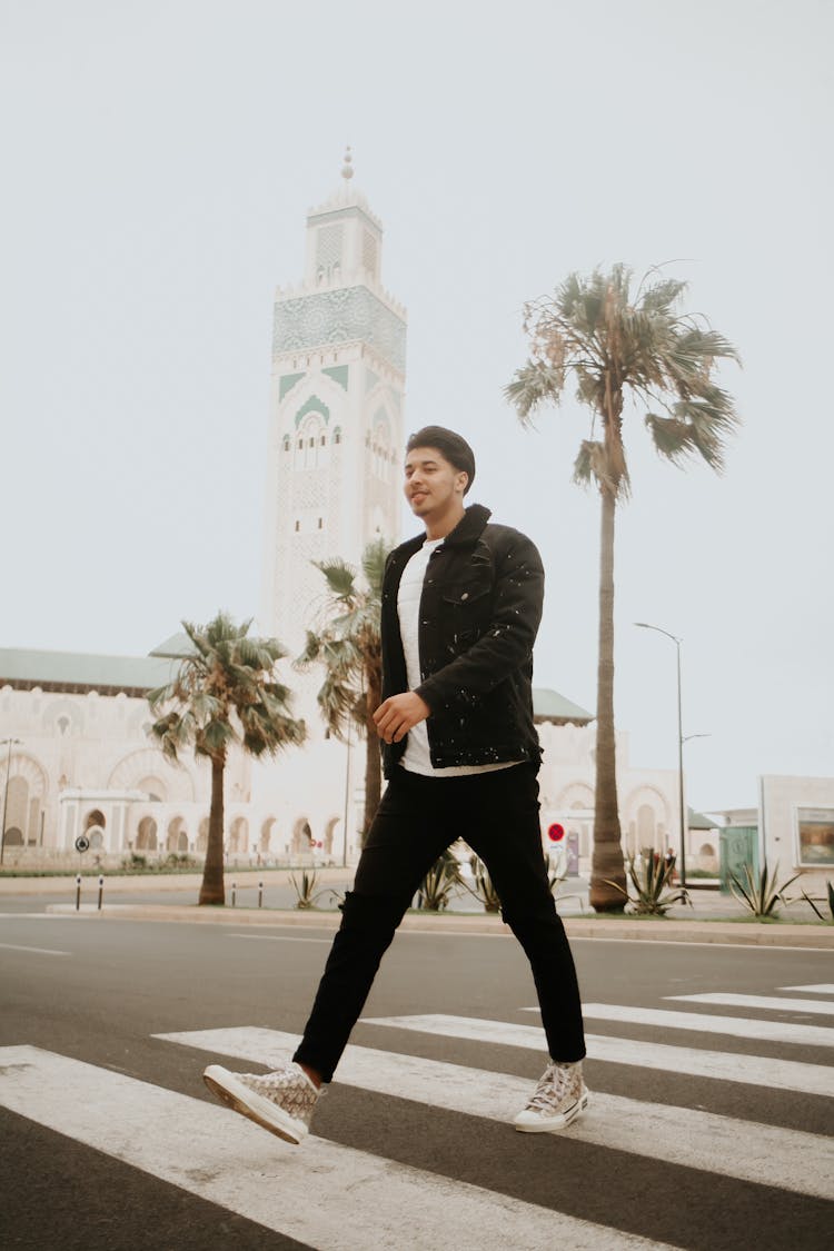 Young Man In A Casual Outfit Crossing The Street In Casablanca, Morocco