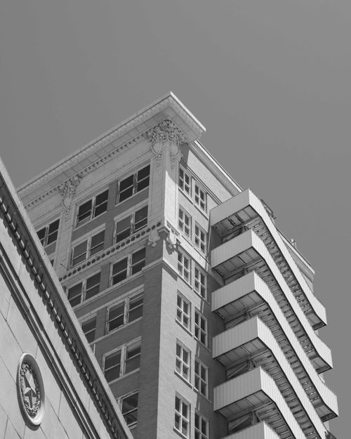 Free Striking contrast of historic and modern architecture in black and white. Stock Photo