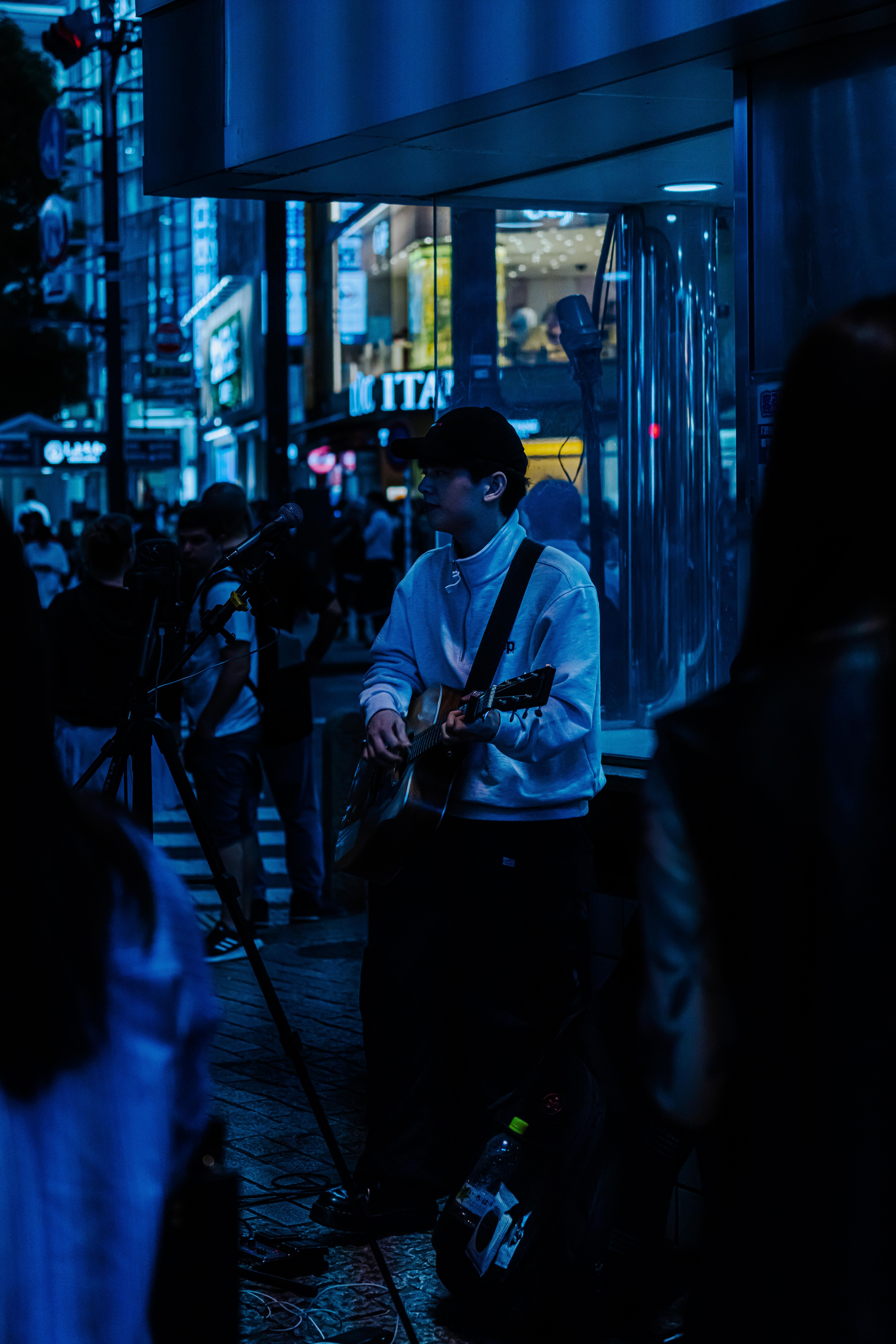 Street Musician Playing Guitar in City · Free Stock Photo