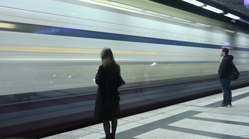 People Standing at the Subway Platform 