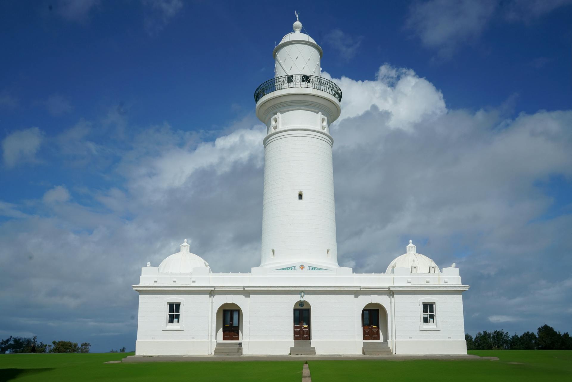 Sydney's iconic Macquarie Lighthouse against a dramatic sky, perfect travel destination.