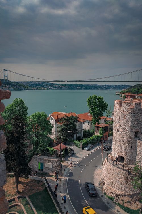 Free A view of the Bosphorus from Rumeli Fortress in Istanbul, featuring a bridge and city streets. Stock Photo