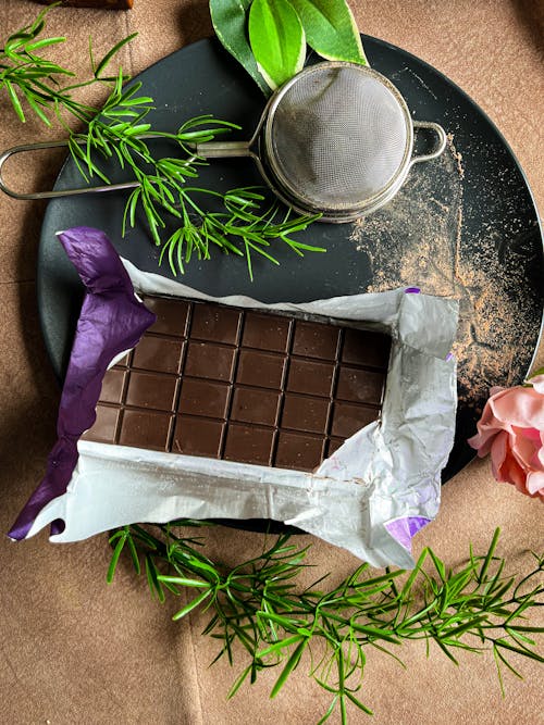 Free Chocolate on a Plate in Open Wrapping Stock Photo