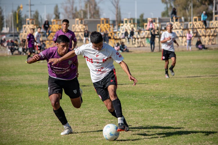 Players Fighting For The Ball At A Youth Soccer Match