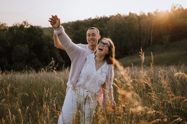 Smiling Couple On Meadow