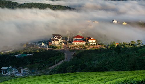 View of Houses in a Mountain Village between Clouds