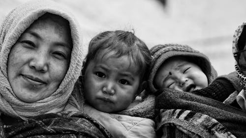Black and White Photo of a Mother with Her Children