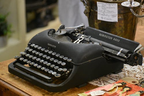 Free Photo of a Black Vintage Typewriter on a Table Stock Photo