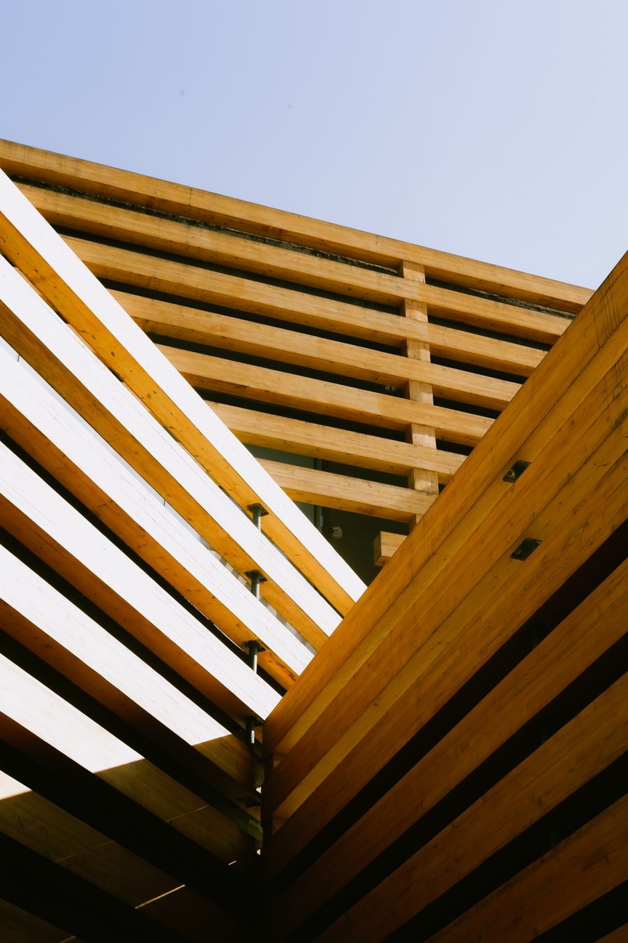 Deep timber eave against the sky