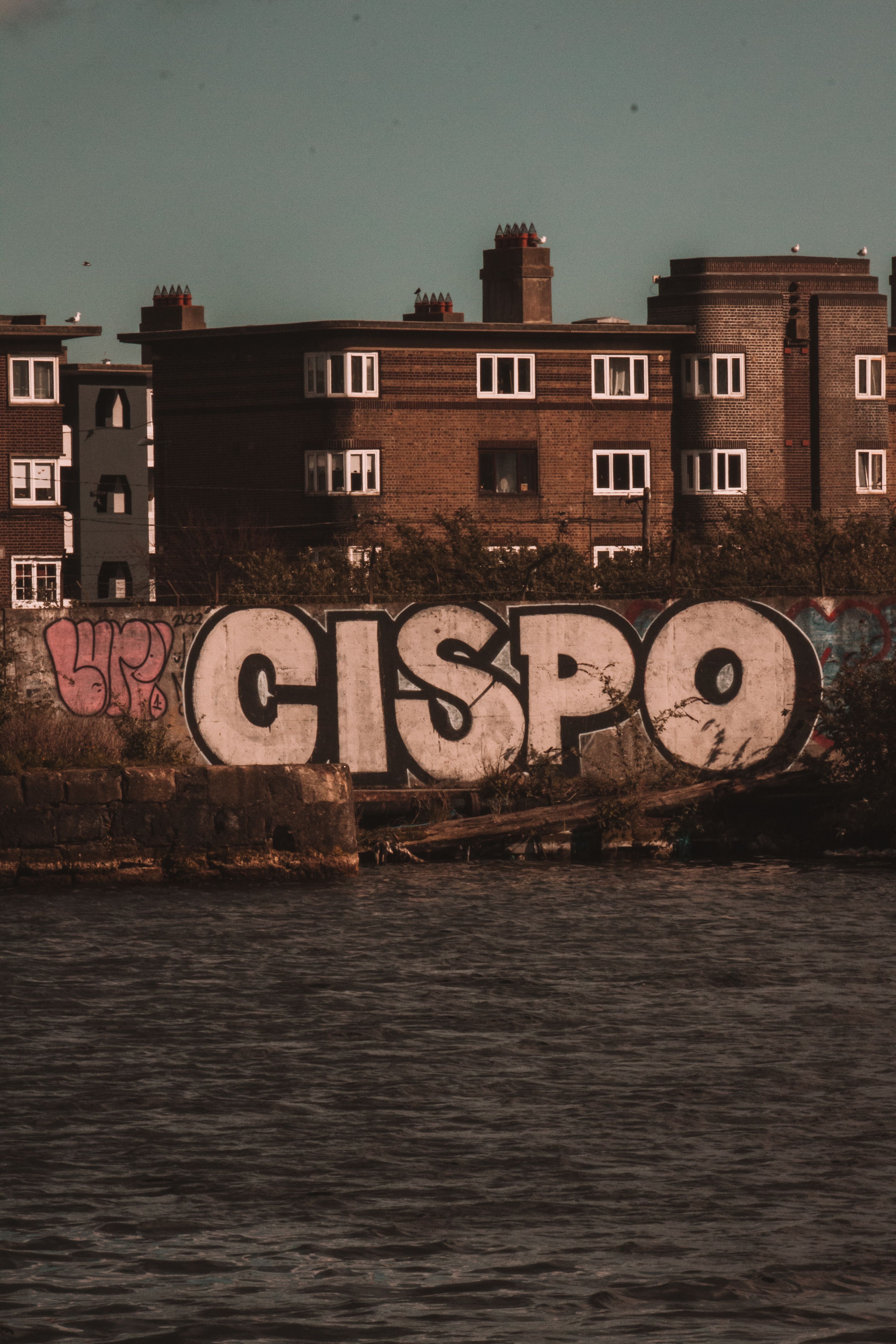 Graffiti on a Wall by the River · Free Stock Photo