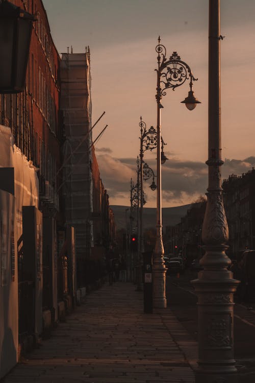 Sidewalk with Decorative Street Lamps at Dusk