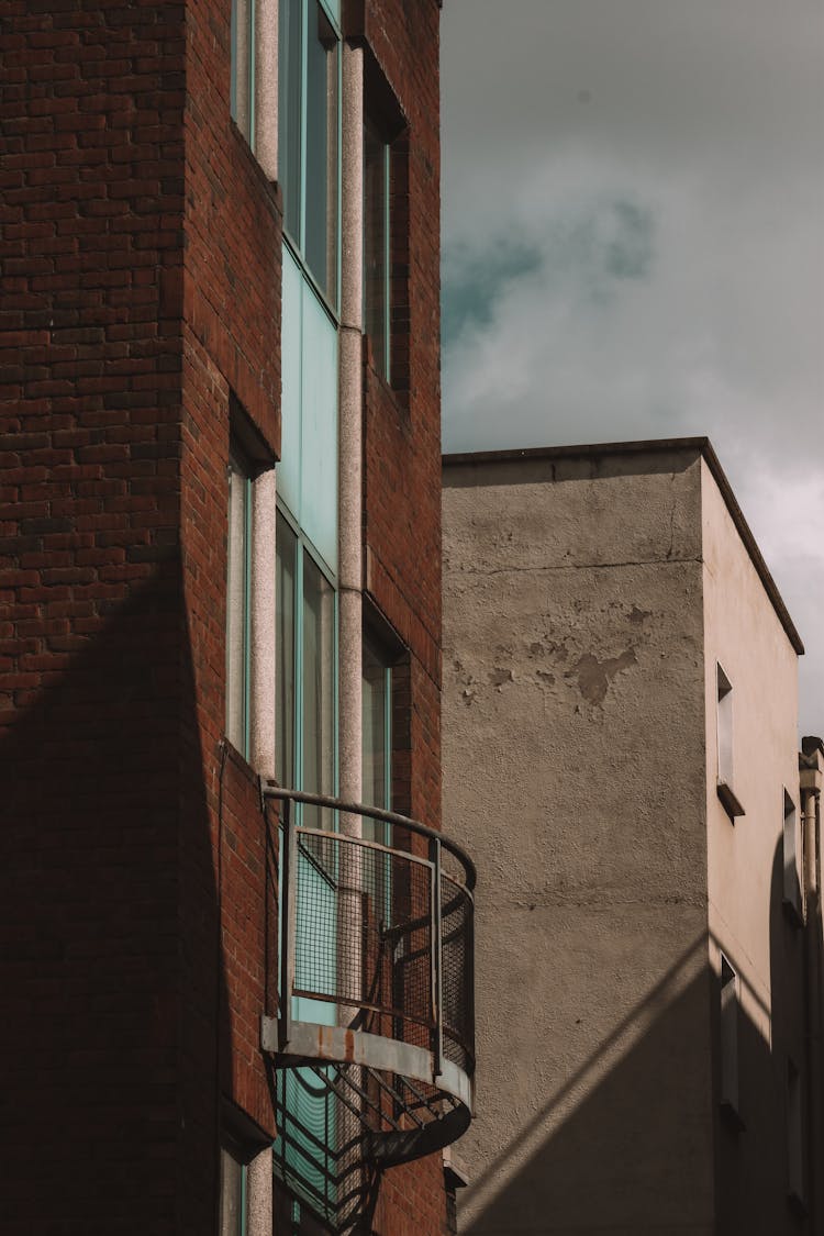 Round Balcony Of An Old Brown Brick House