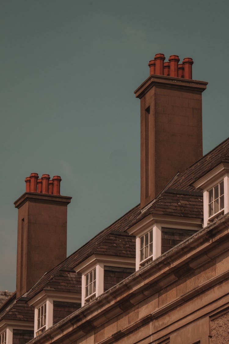 Chimneys On The Roof Of A House