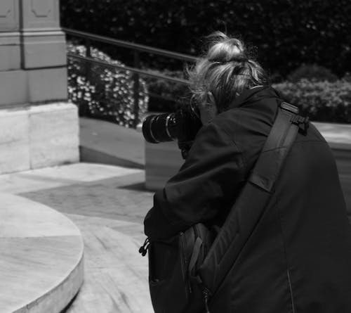 Woman Taking Photos in Black and White