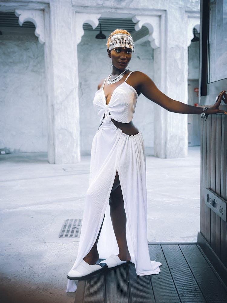 Woman Wearing White Dress Posing On A Street