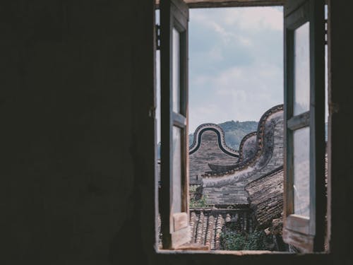 Free View of Historic Buildings in Shangyue Village through an Open Window Stock Photo