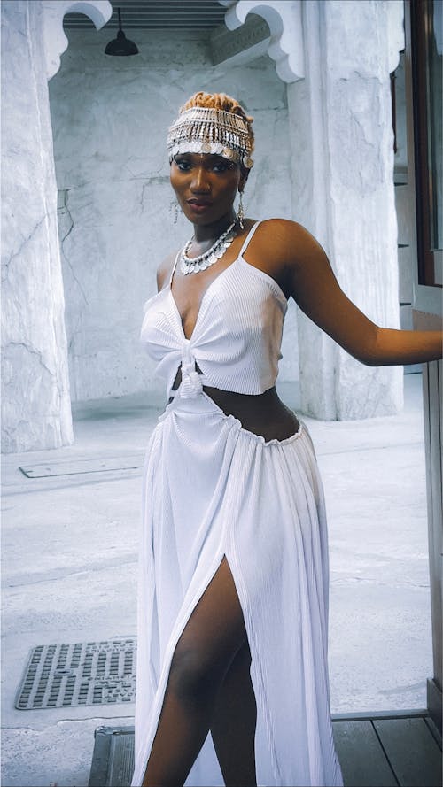 Woman Posing in White Dress