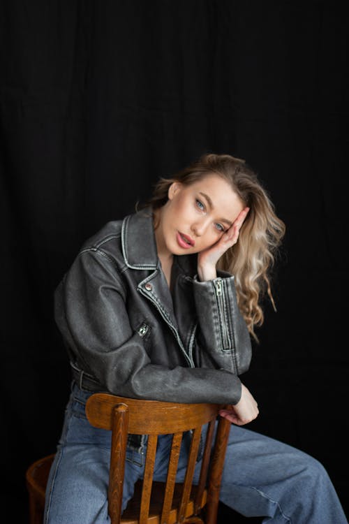 Studio Shot of a Young Woman in Jeans and a Leather Jacket