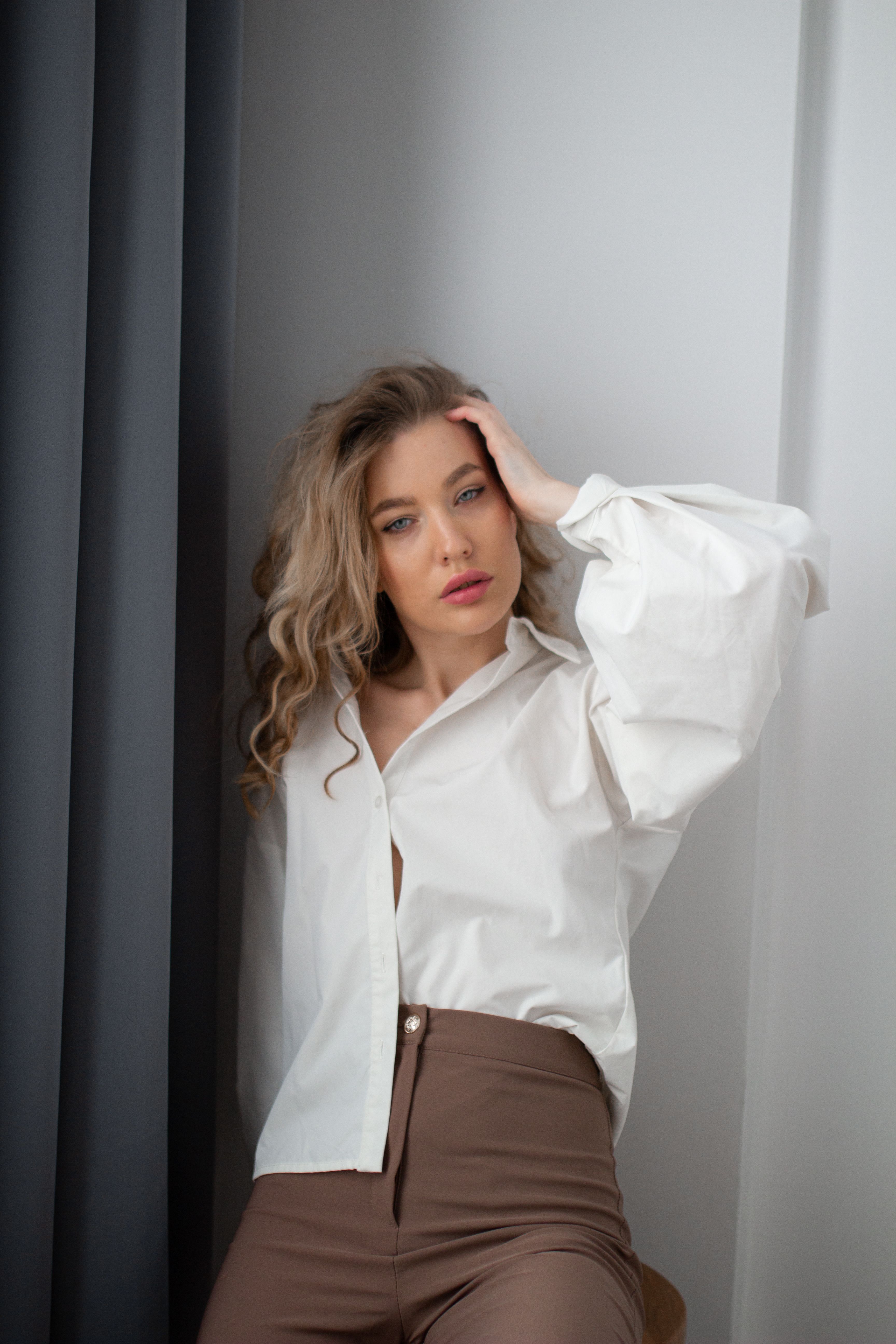Studio Shot of a Young Woman Wearing a White Shirt · Free Stock Photo