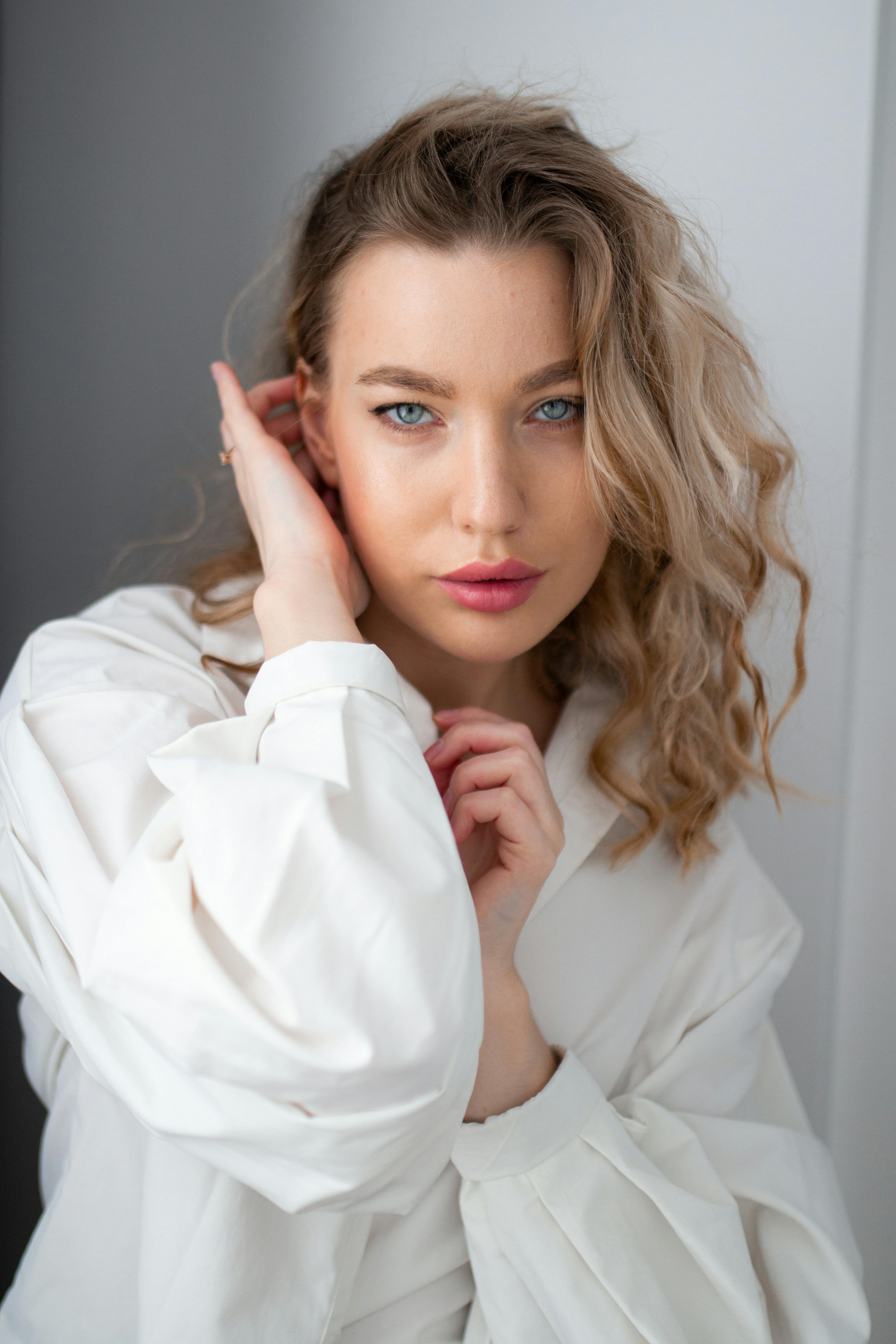 Studio Shot Of A Young Woman Wearing A White Shirt Free Stock Photo studio-shot-of-a-young-woman-wearing-a-white-shirt-free-stock-photo