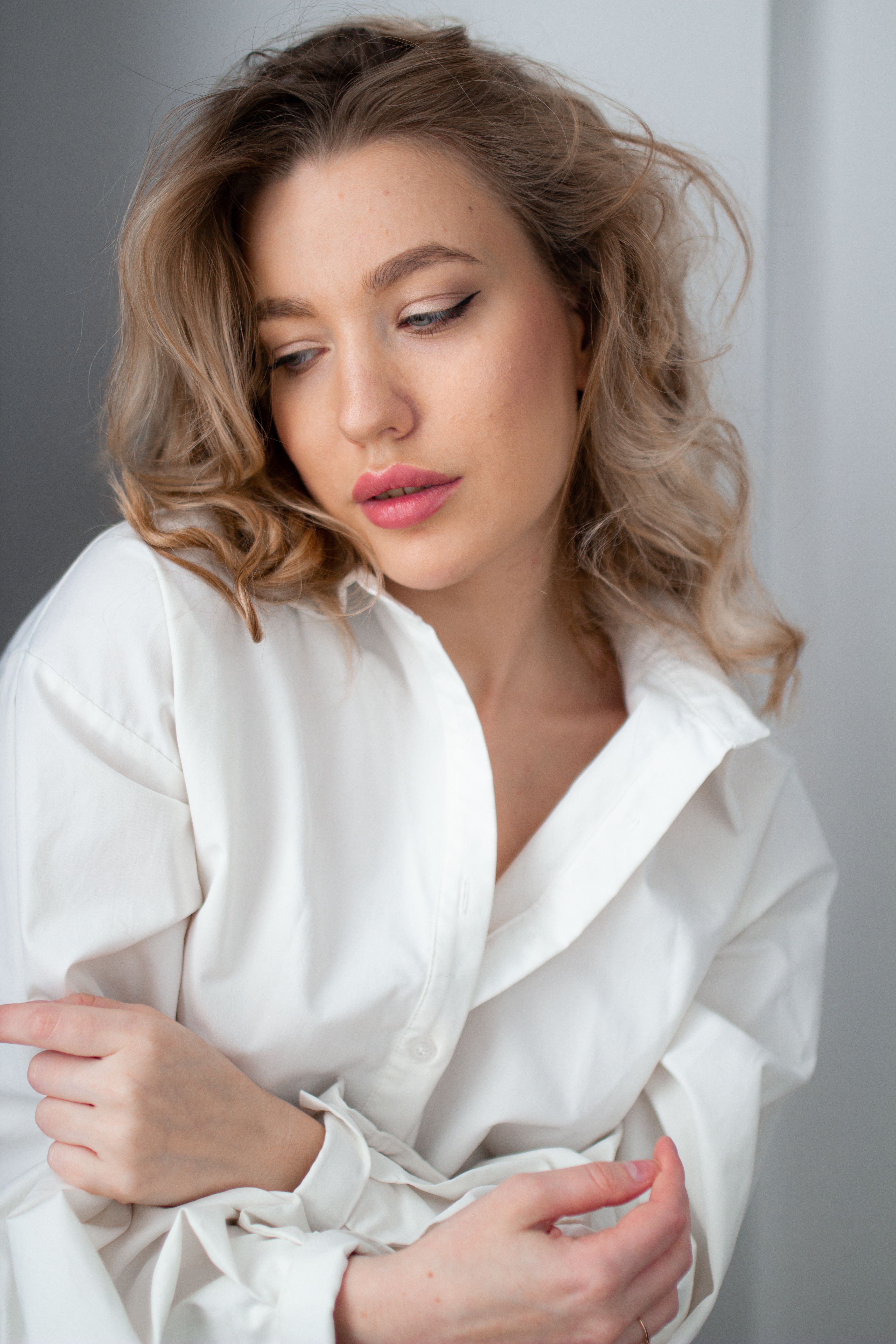 Woman in White Shirt Posing with Wine Glass on Table · Free Stock Photo