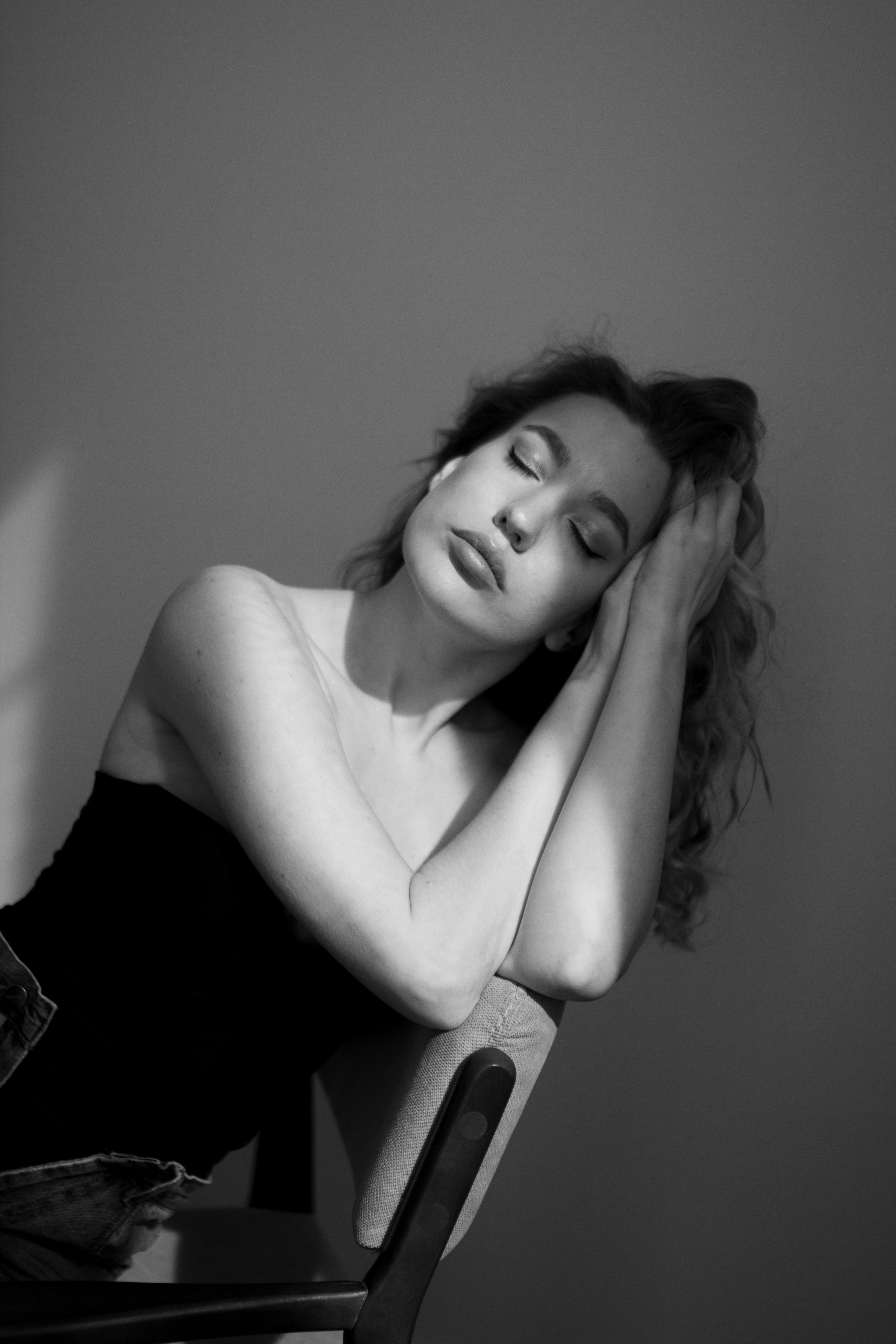 A Woman Sitting with her Eyes Closed · Free Stock Photo
