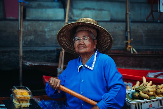 Elderly Woman in Hat and Blue Clothes