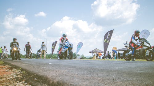 Motorcycle Racers on Asphalt Road