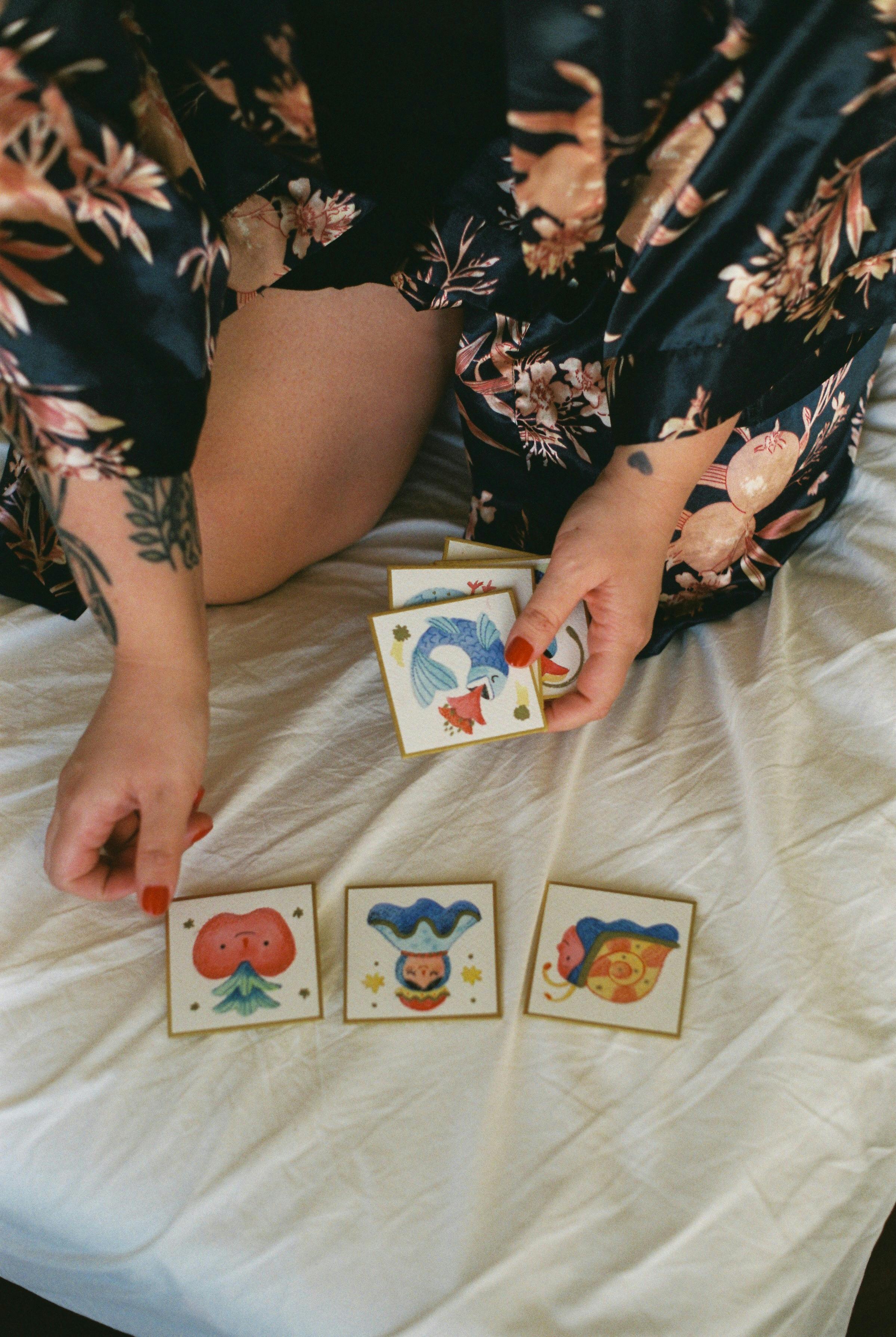 woman hands holding cards