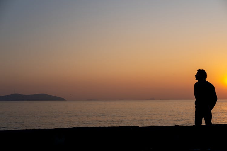 Silhouette Of A Man In Sunset