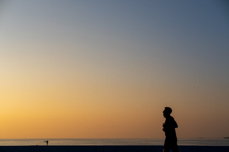 Silhouette Of A Man In Sunset