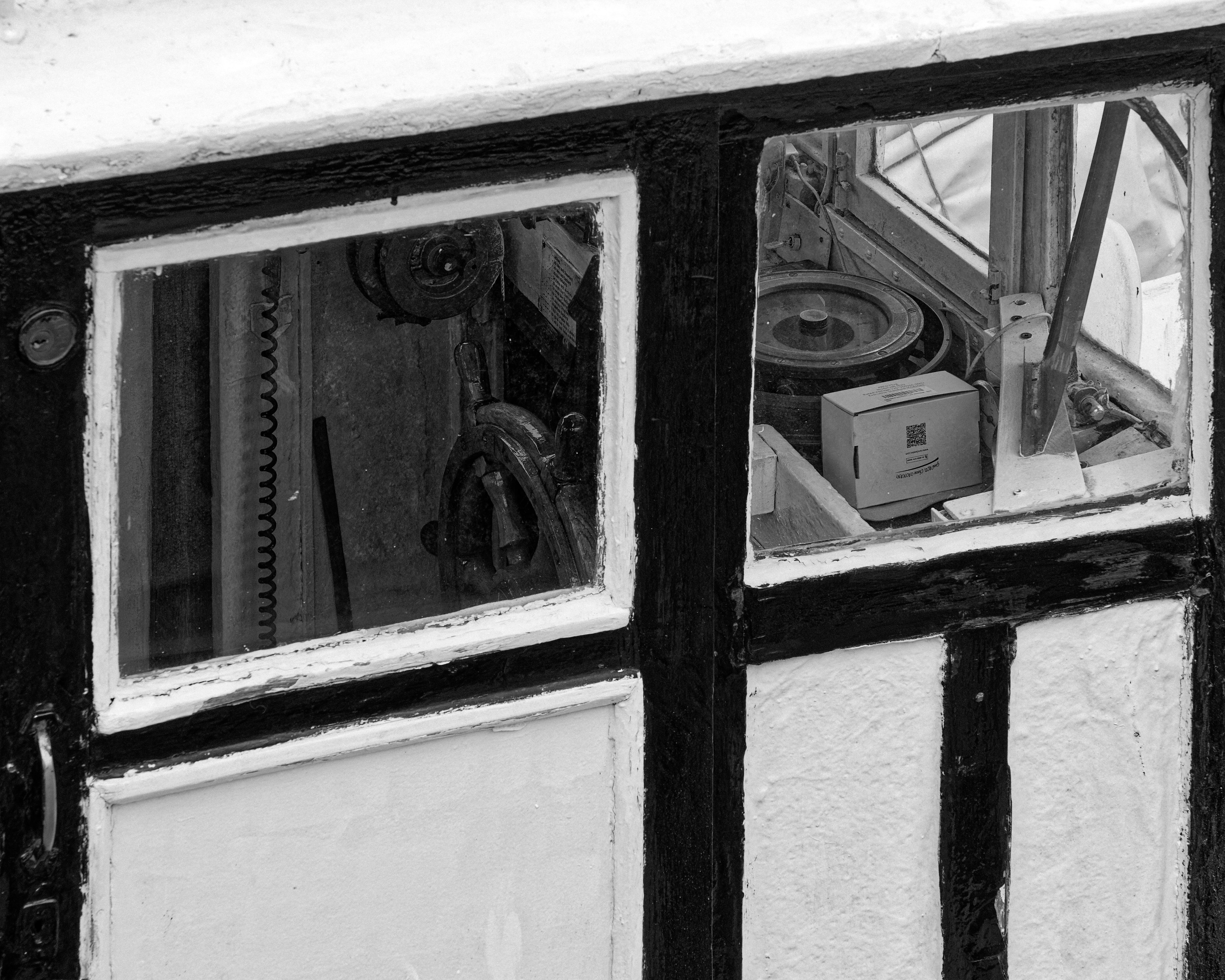Vintage Devices behind Windows in Black and White · Free Stock Photo