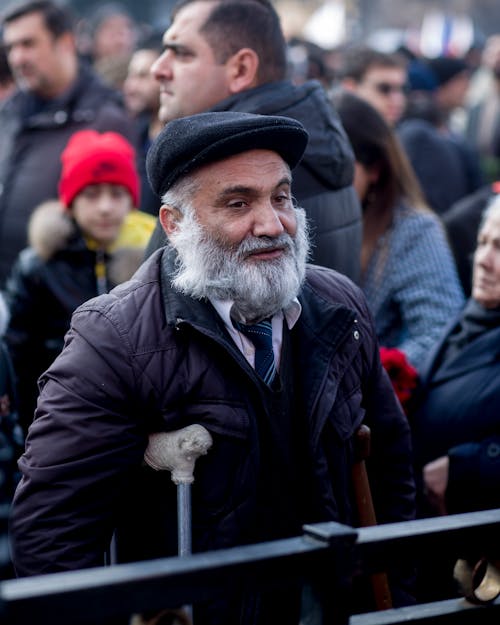 Man with Beard Standing in Crowd
