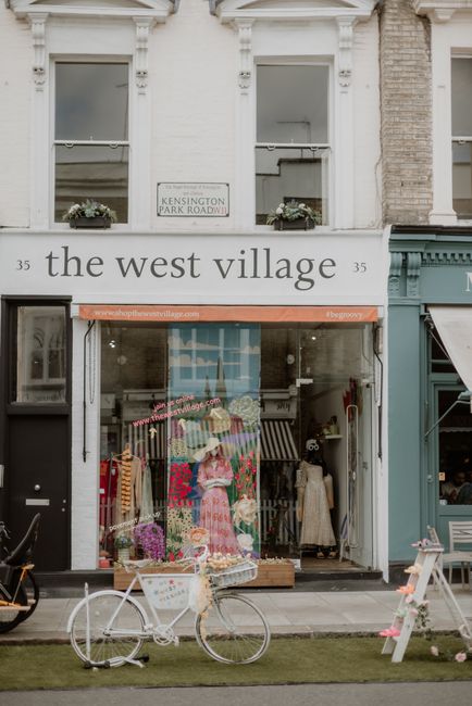 A charming clothes store front in Kensington Park Road with vintage bicycle decor.