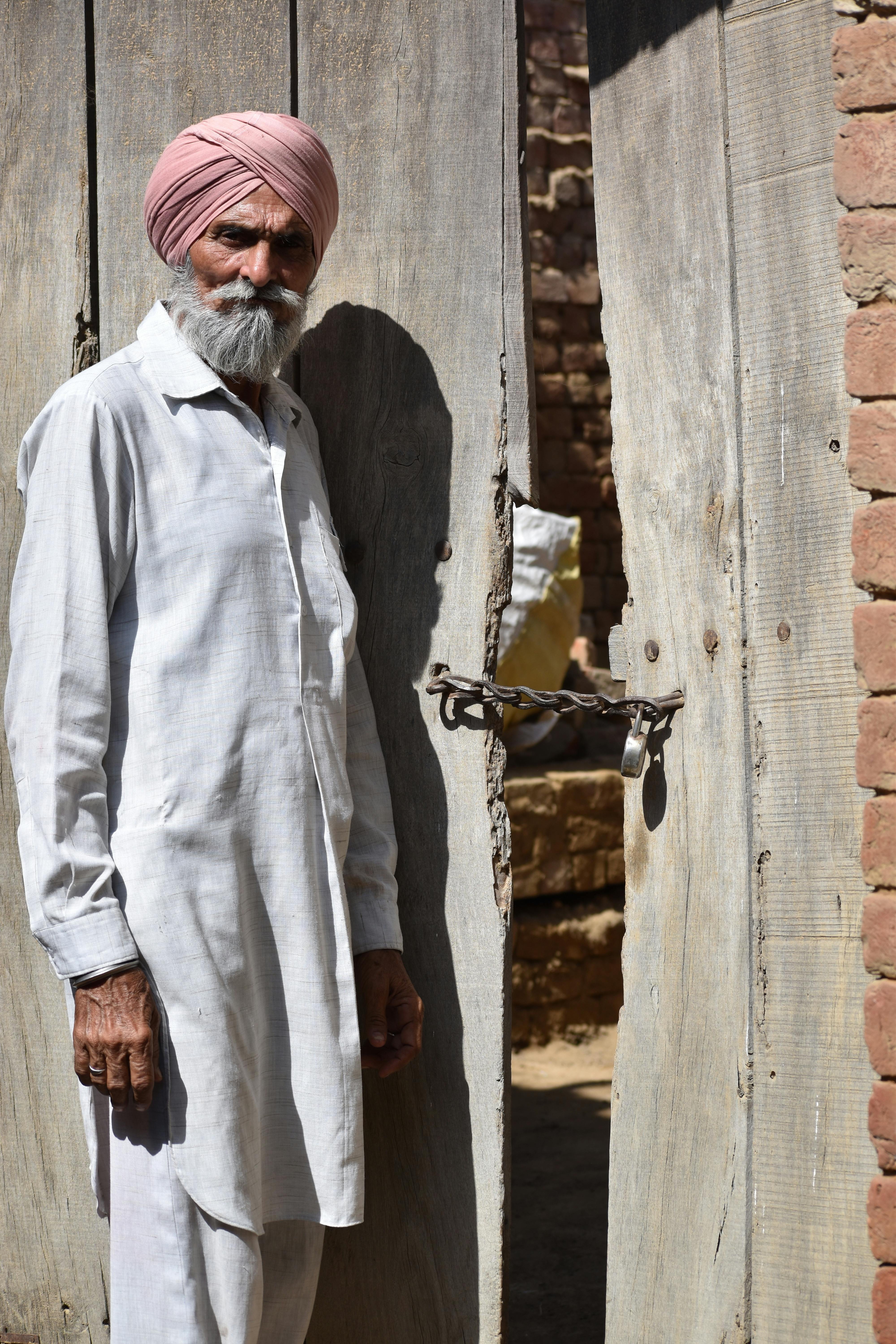 Old Man with old door Free Stock Photo