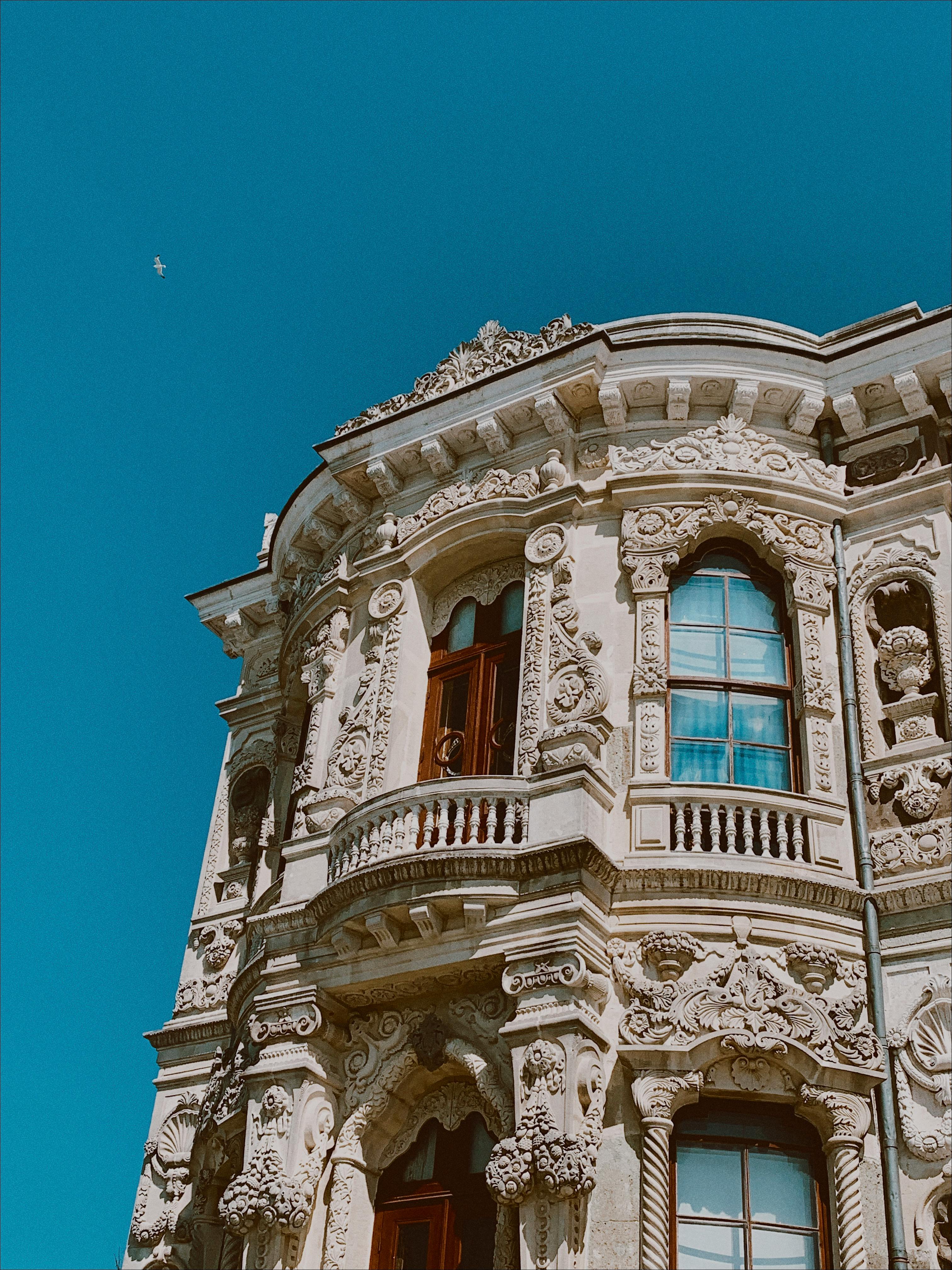 A detailed view of the Kucuksu Pavilion's ornate facade under a clear blue sky in Istanbul, Türkiye.