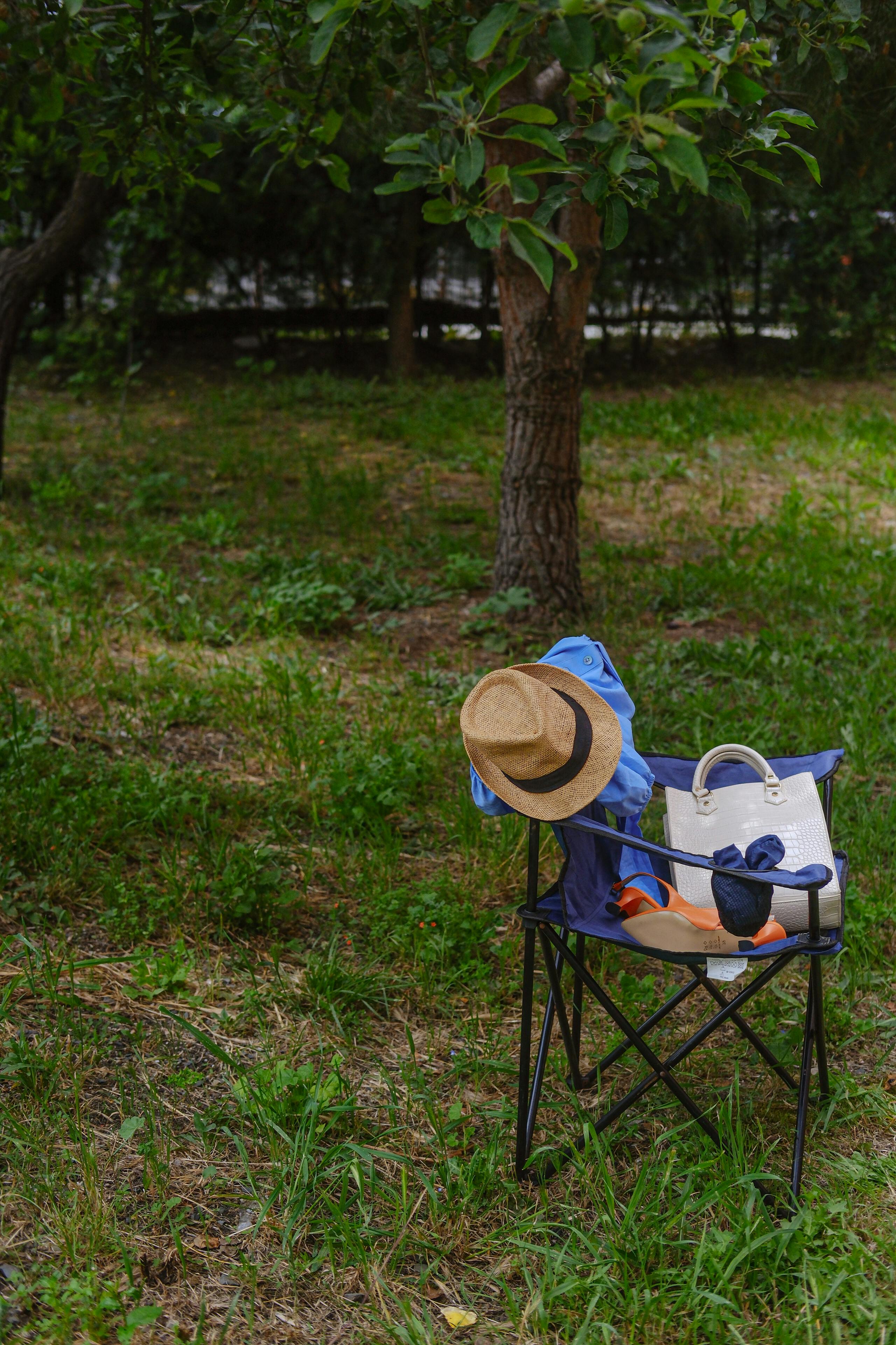 a stuffed animal sitting on a chair in the grass