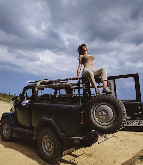 Woman Posing on a Jeep