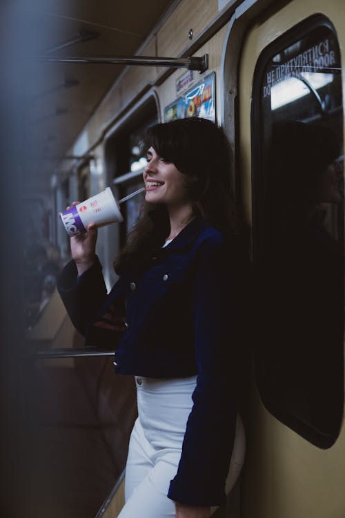 Smiling Woman on Metro Train