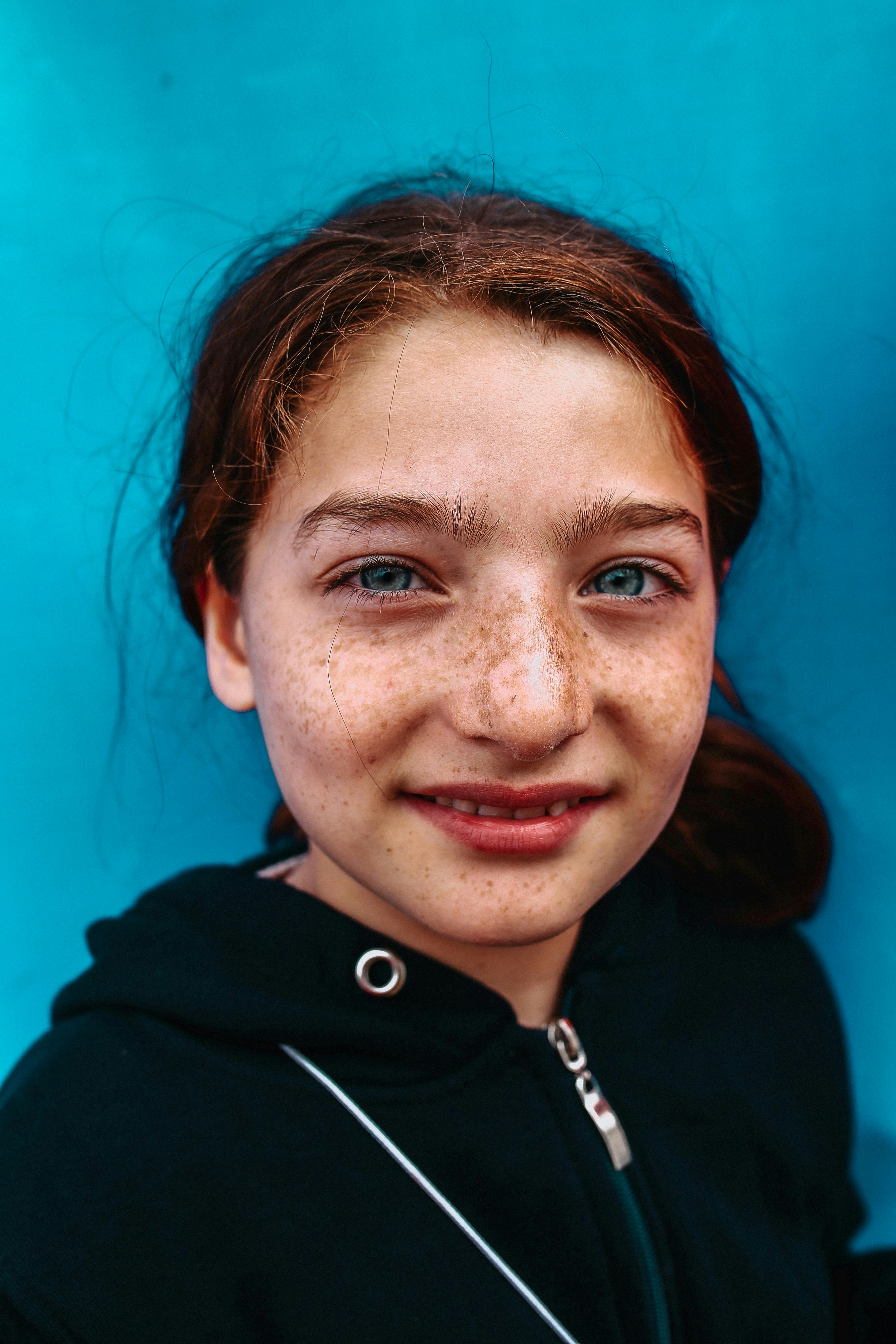 a teenage girl with freckles